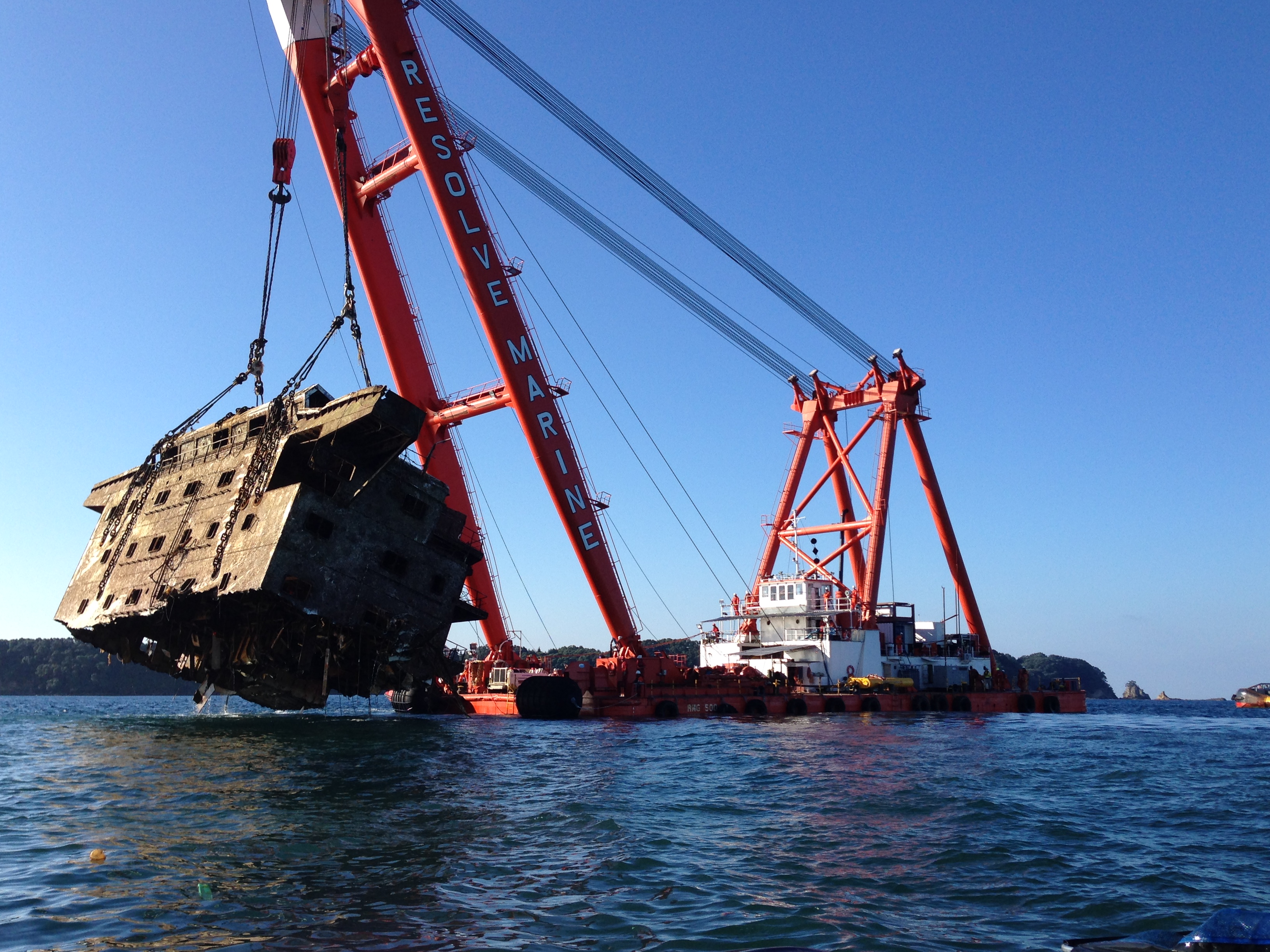 Resolve Marine crane vessel lifting wreckage during the Rena salvage operation
