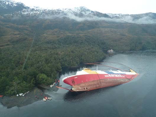 The Amadeo 1 lies sideways on her stern in water