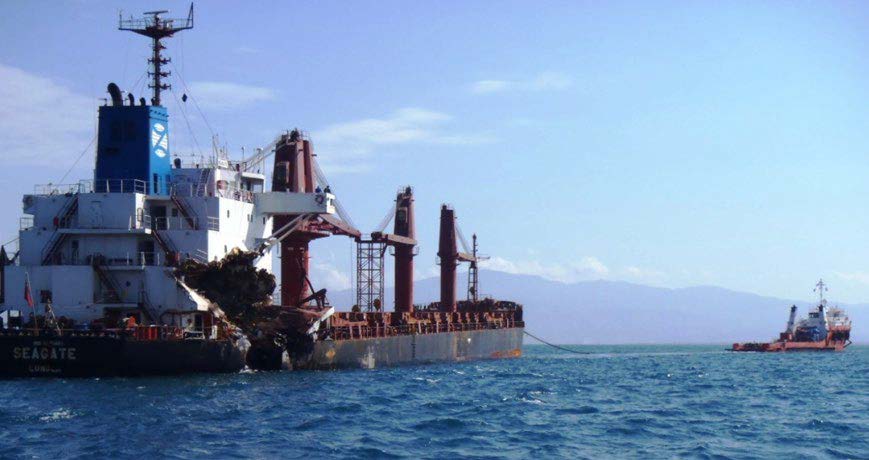 A large ship is towed by Resolve Marine